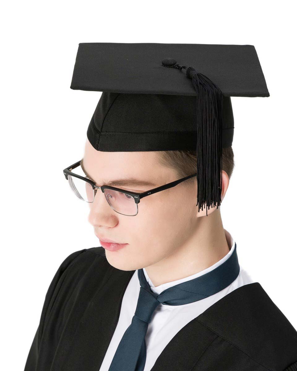 Picture of a Happy Young Man in Graduation Gown and Mortarboard stock photo  | Creative Fabrica